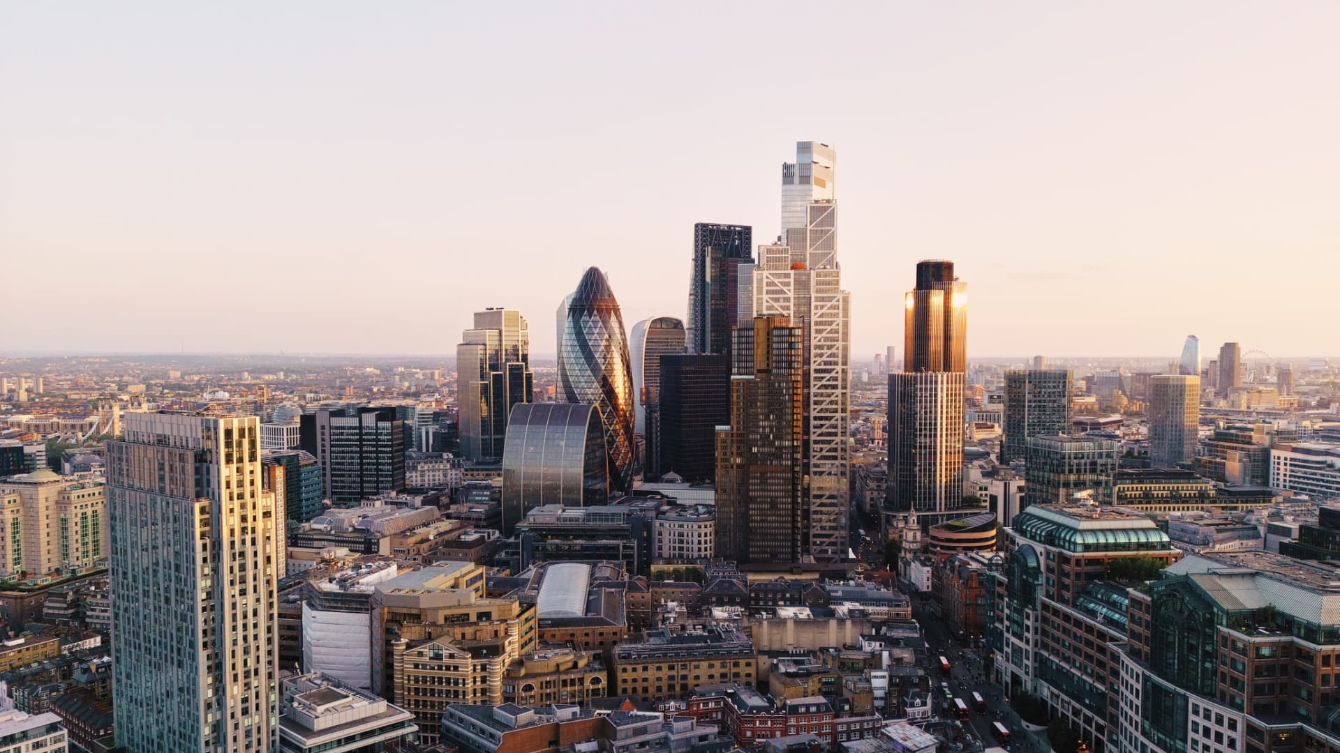 The City of London skyline at sunset.
