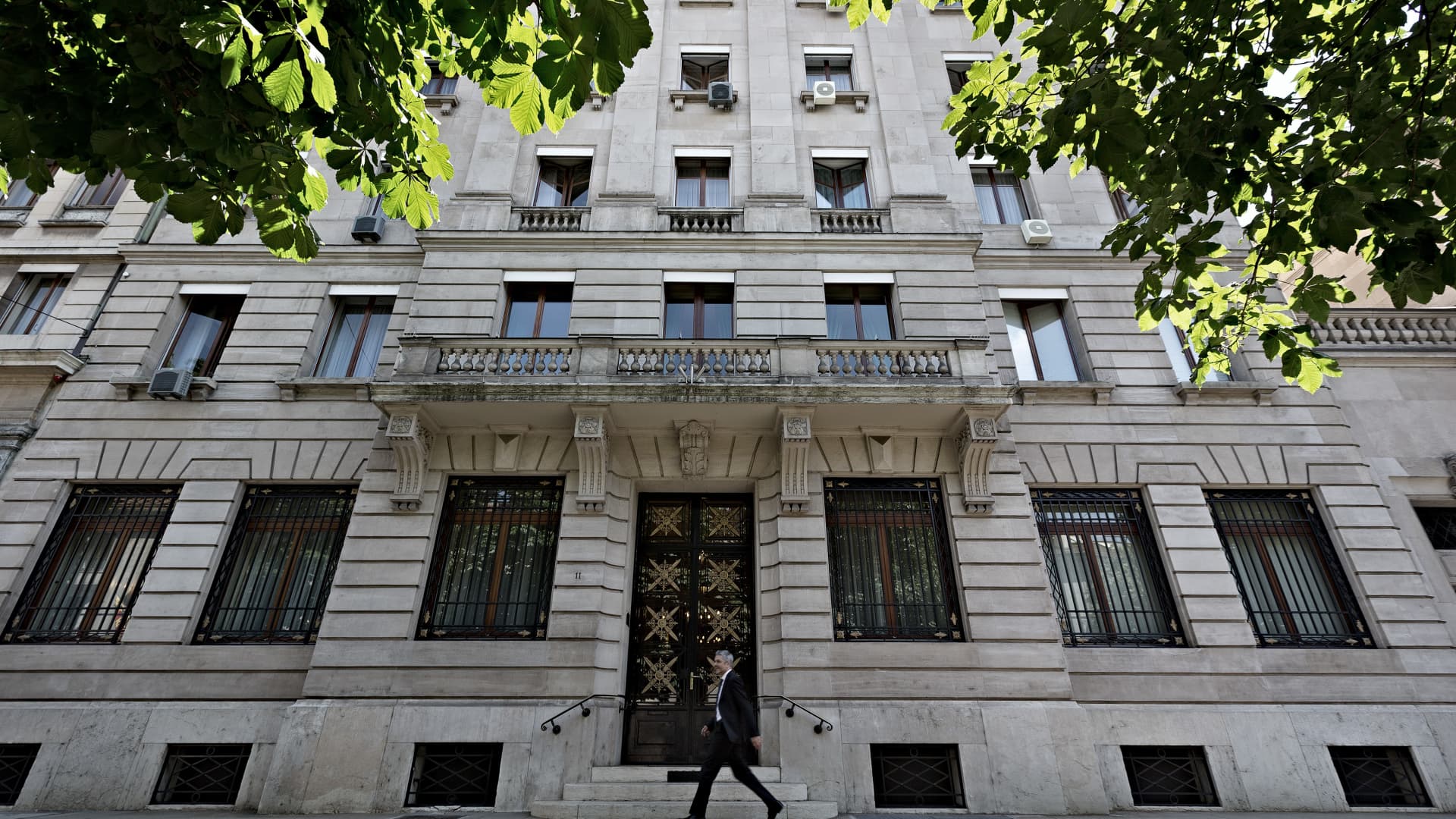 A pedestrian walks by the entrance to Lombard Odier in Geneva, Switzerland.