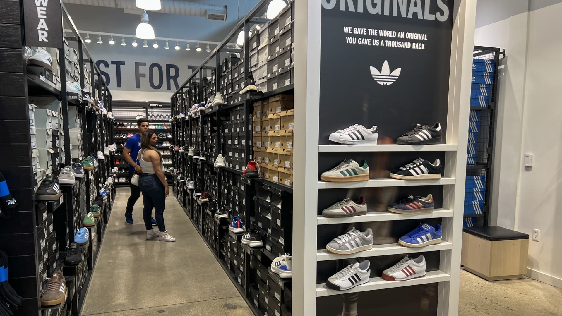 Customers shop in an Adidas store on April 4, 2025 in Miami, Florida.  