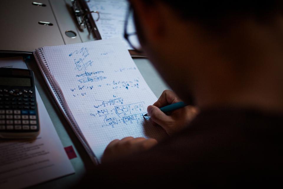 Young Man learning Math and Physics