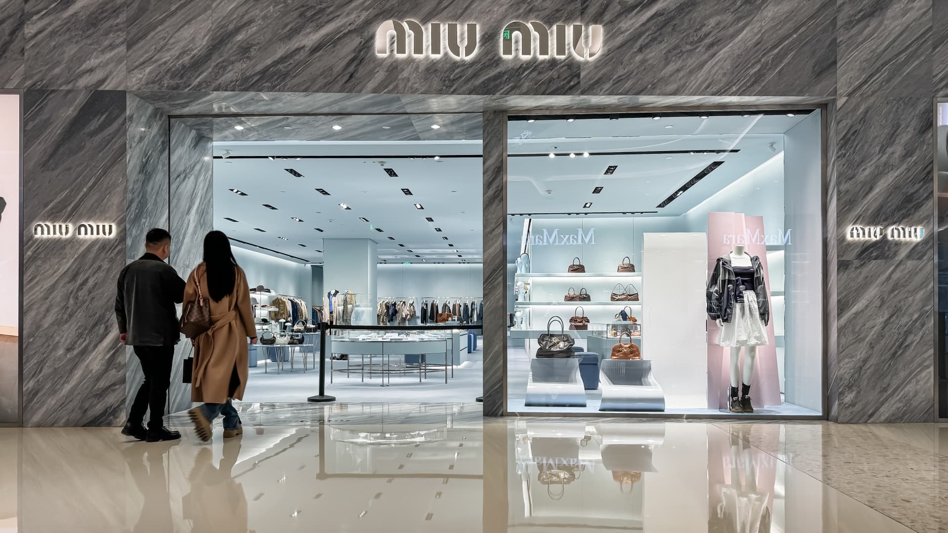 A couple walks into a Miu Miu store on March 1, 2025 in Chongqing, China
