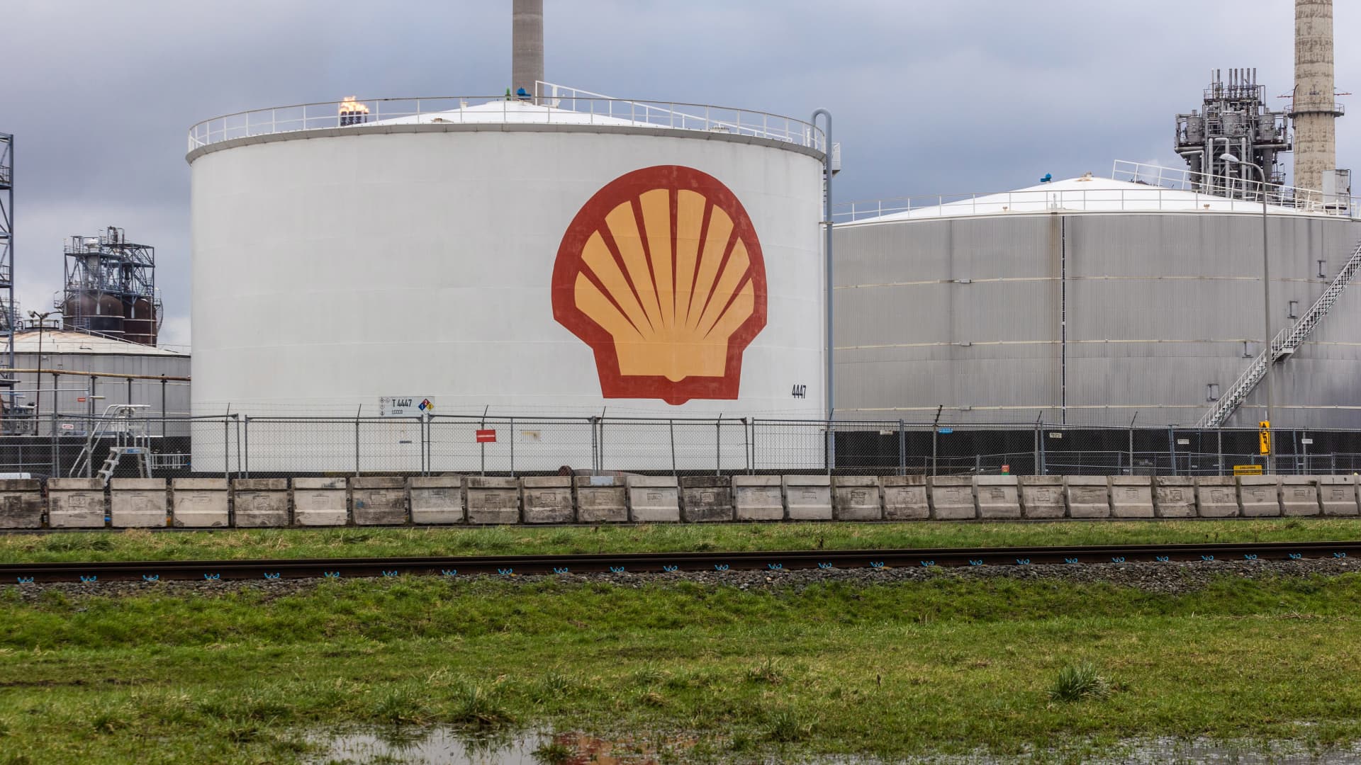Oil storage silos beyond waterlogged land at the Shell Plc Pernis refinery in Rotterdam, Netherlands, on Sunday, Feb. 11, 2024.