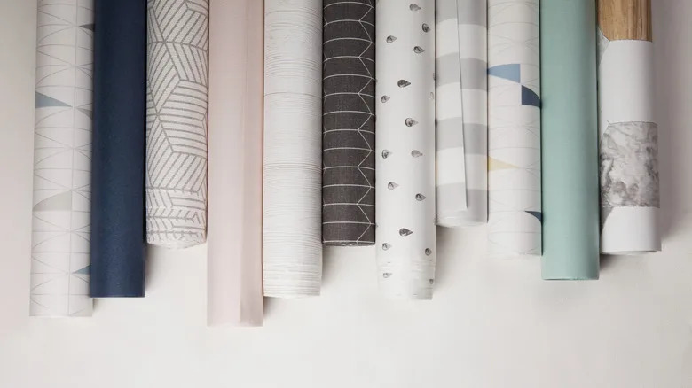 A variety of patterned wallpaper on a white table