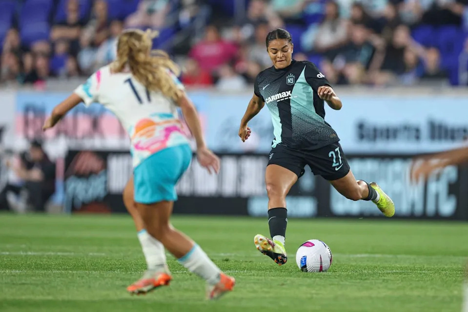 Gotham FC defender Jess Carter (27) passes the ball in front of San Diego Wave FC midfielder KImmi Ascanio (17) during the first half on May 16. IMAGN IMAGES via Reuters Connect