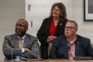  Regent Kathy Wilmot of Beaver City, center, is flanked by Chancellor Rodney Bennett and Mike Zeleny, vice chancellor for business and finance, both at the University of Nebraska-Lincoln. April 26, 2024. (Zach Wendling/Nebraska Examiner)