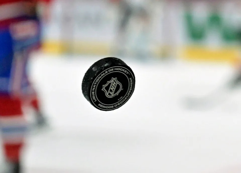 French logo on an NHL puck during the warm-up period before a game between the Philadelphia Flyers and the Montreal Canadiens. (Eric Bolte-Imagn Images)