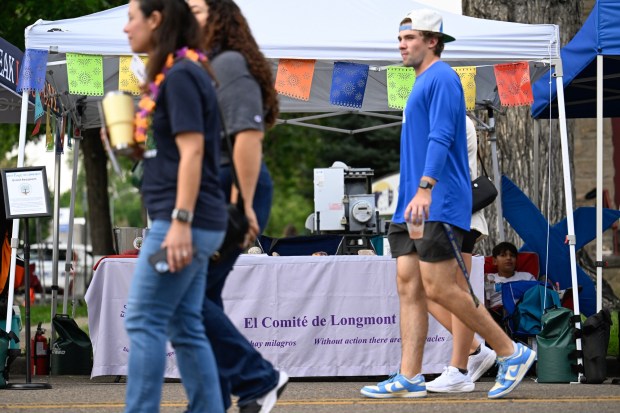 The El Comité de Longmont booth is seen during Longmont's Unity in the Community on Friday. (Matthew Jonas/Staff Photographer)