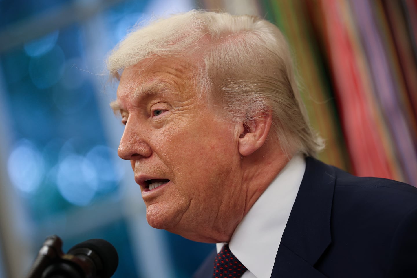 President Trump speaks during an event with Apple CEO Tim Cook in the Oval Office of the White House on Aug. 6, 2025 in Washington, D.C. 