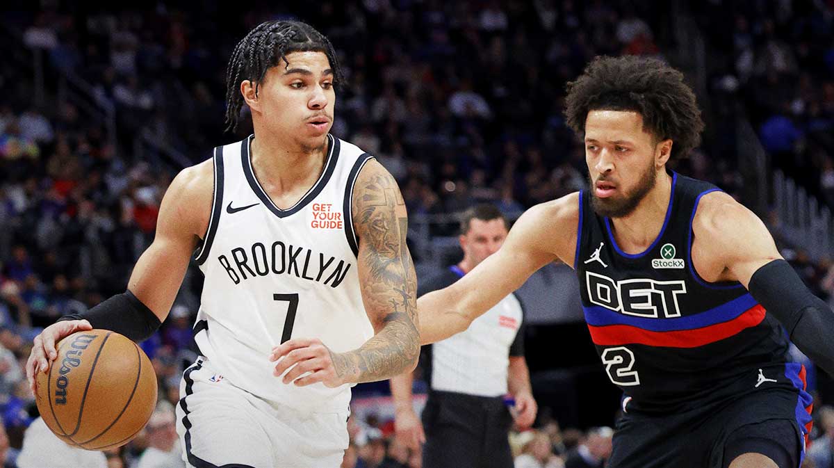 Brooklyn Nets guard Killian Hayes (7) dribbles defended by Detroit Pistons guard Cade Cunningham (2) in the first half at Little Caesars Arena.