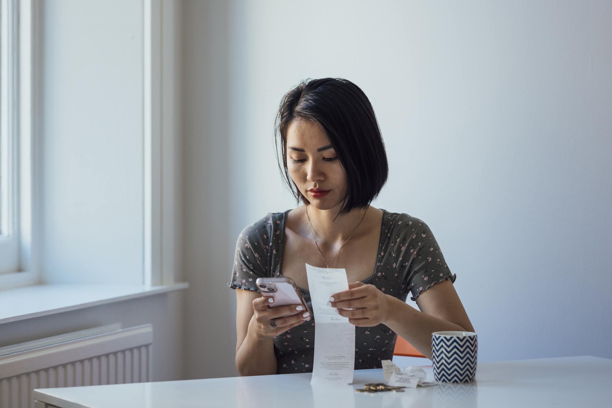 Woman looking at expenditure and managing personal finances