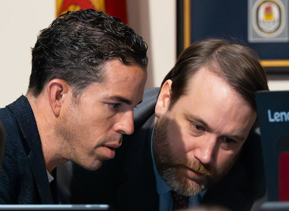 Chairman Raul Arias, left, talks with Brian Parks with the Council Auditor's Office during the Finance Committee’s August budget hearings Thursday August 14, 2025 at Jacksonville City Hall. After the Finance Committee completes its version of the 2025-26 budget, the full council will vote on it in September. [Doug Engle/Florida Times-Union]