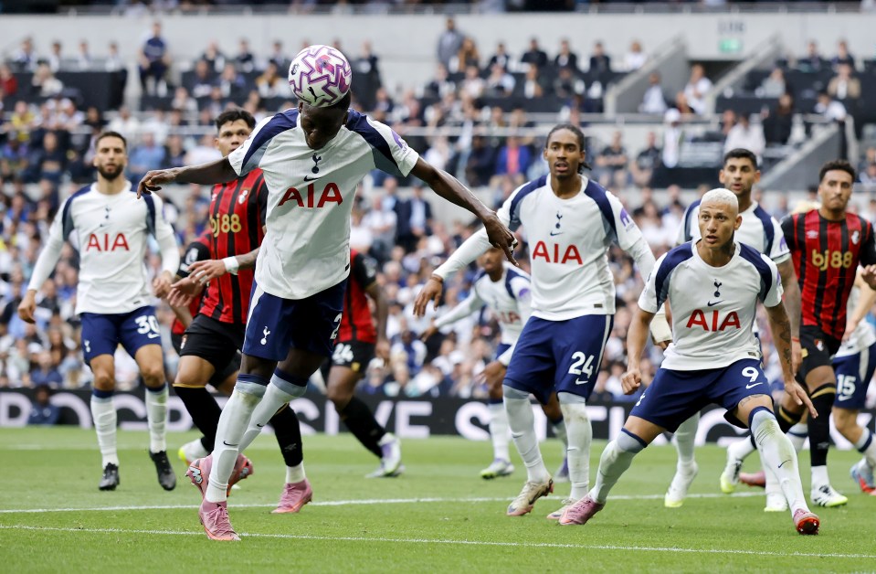 Pape Matar Sarr of Tottenham Hotspur heading the ball during a soccer match.