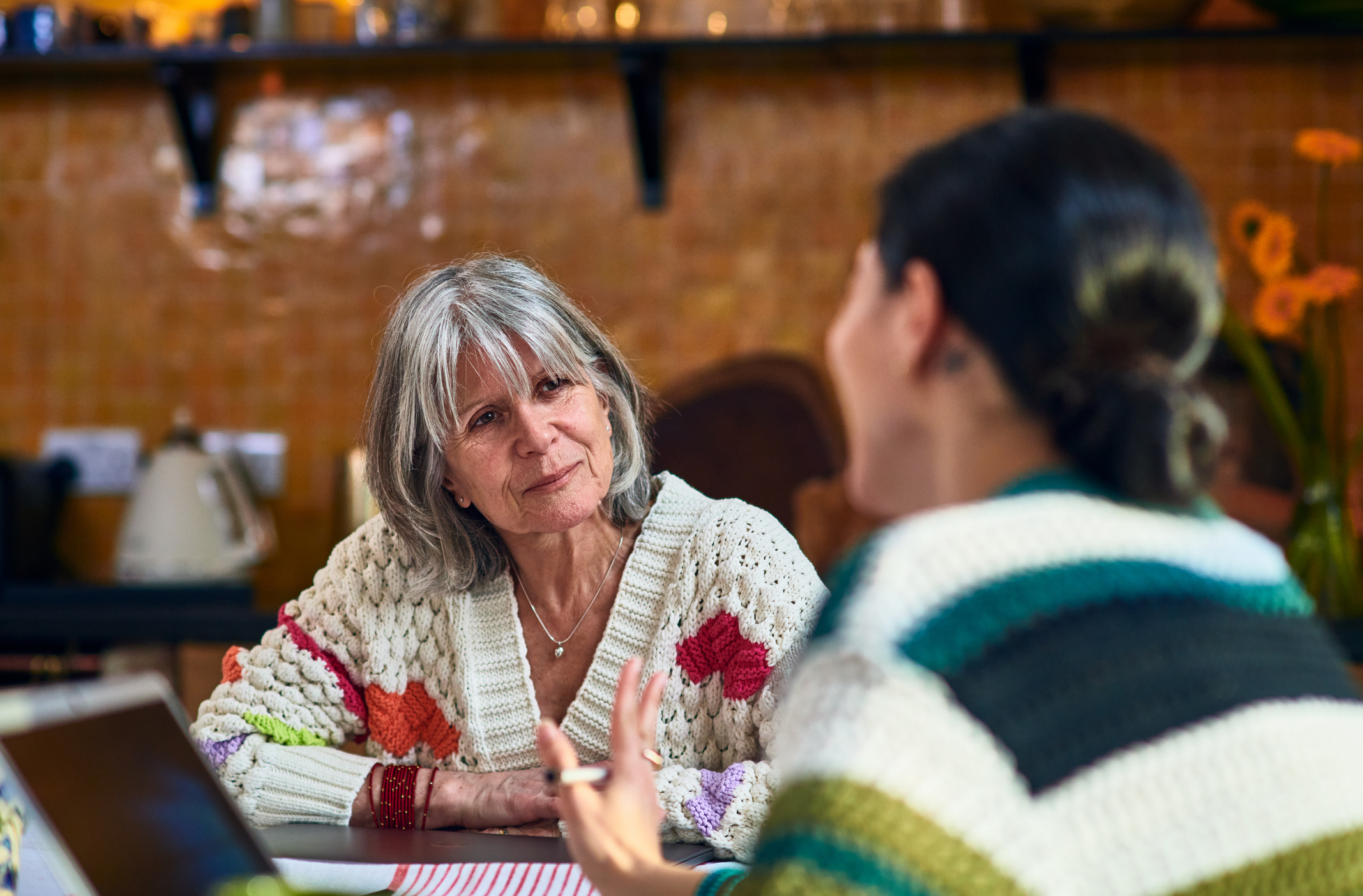 Two women discussing finance