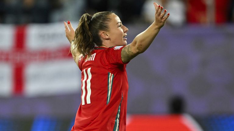 Hannah Cain celebrates her goal for Wales against England
