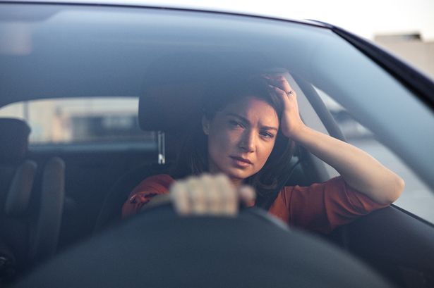 Woman worried while driving