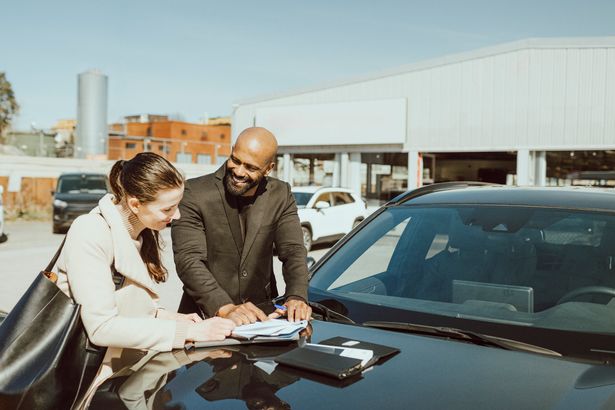 Woman purchasing car