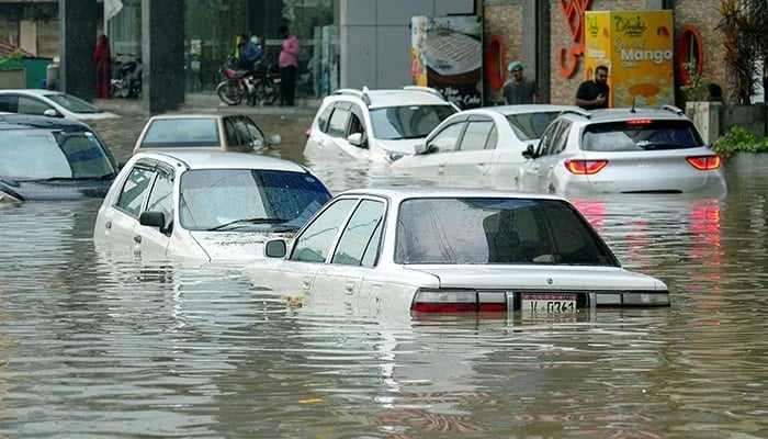Partially submerged vehicles move, as some are parked, after the monsoon rain in Karachi, Pakistan, August 19, 2025. — Reuters