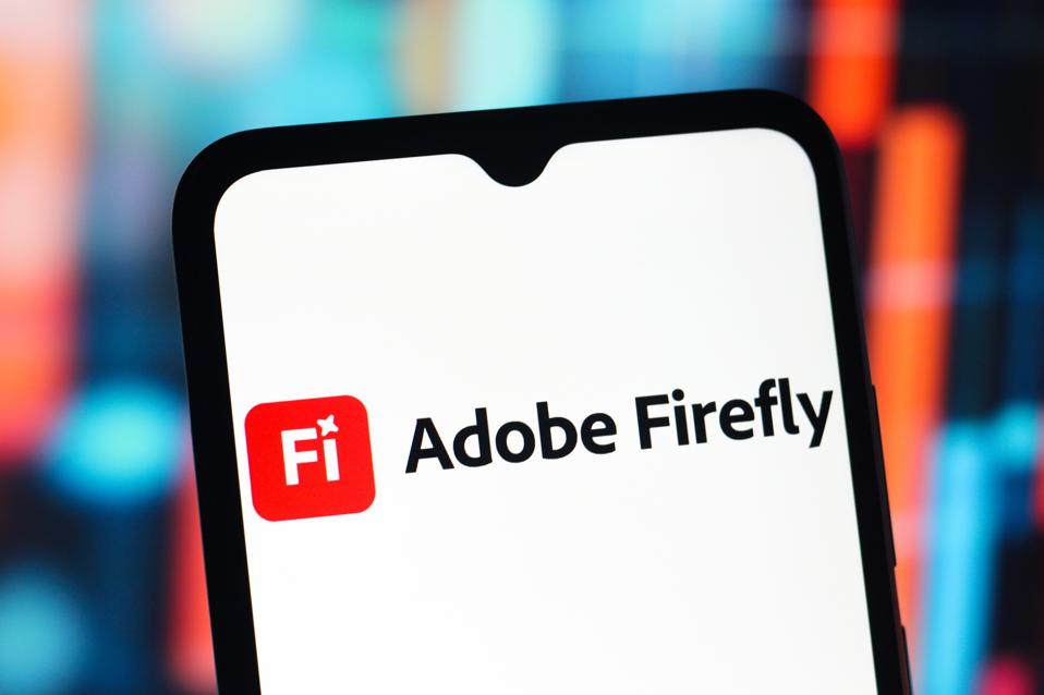 In this photo illustration, the Adobe Firefly AI logo is...
