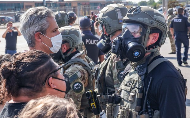 Evanston Mayor Daniel Biss, top left, stands with protesters as federal agents cleared a path for their vehicles to enter and exit the Immigration and Customs Enforcement facility in Broadview on Sept. 12, 2025. (Dominic Di Palermo/Chicago Tribune)
