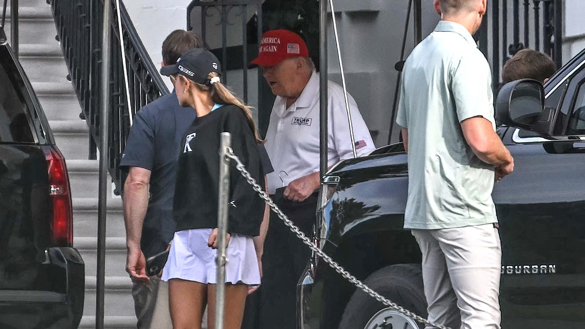 President Donald Trump with grandchildren at golf club