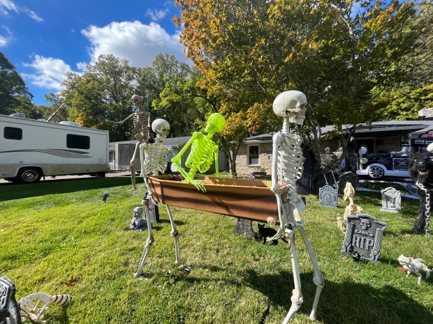 The festive display, which takes about two weeks to assemble, features skeletons, lights, and other spooky decorations that have caught the attention of neighbors and passersby.(Clara Wicinski -- Lorain Morning Journal)