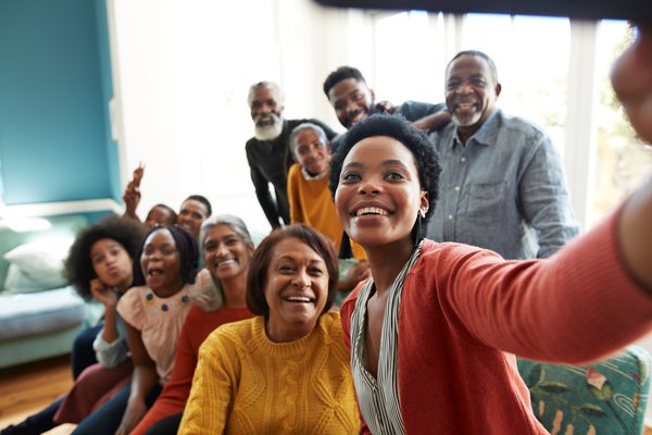 A group of people smiling for a selfie.