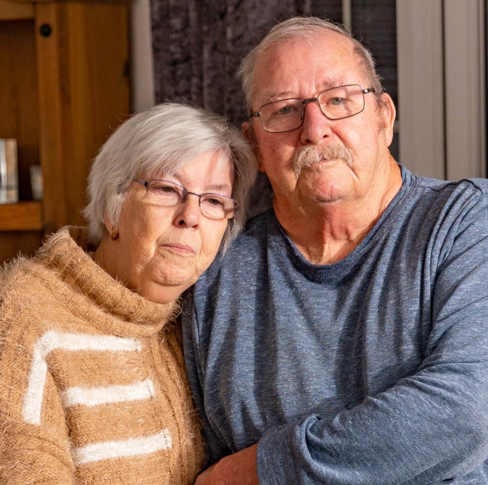 Pensioners Jan and Charlie Hughes holding hands.