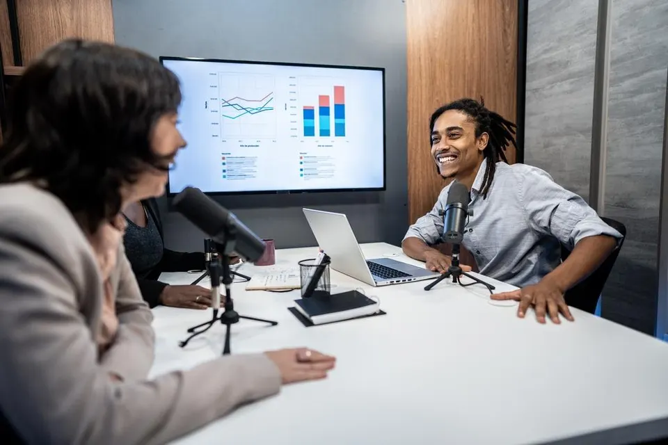 Young man during the recording of a podcast show with a colleague