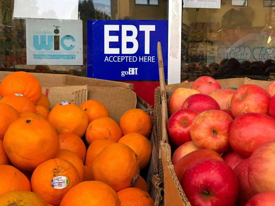 SNAP provides monthly benefits to millions of Americans via an Electronic Benefits Transfer (EBT) card, which can be used to buy groceries at authorized retailers. Stores often advertise their participation in the program.