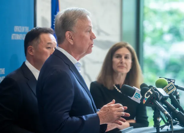 Governor Ned Lamont talks to the media as he stands with Attorney General William Tong and Lt. Governor Susan Bysiewicz during a press conference in the visitors' lobby at the Office of the Attorney General on Tuesday, June 10, 2025. The press conference was about their response to the lawsuit filed by California against President Donald Trump and Defense Secretary Pete Hegseth after the California National Guard was brought in during protests in Los Angeles over the weekend.. (Aaron Flaum/Hartford Courant)