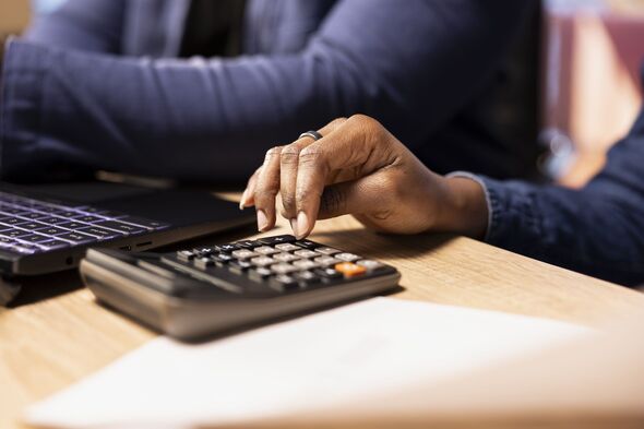 Married couple managing their bills and household payments at home