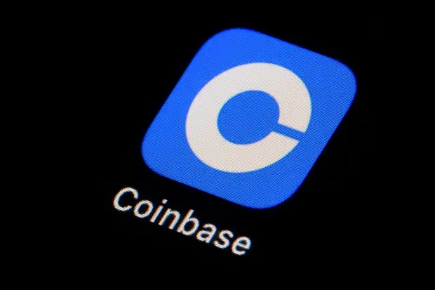 FILE - The Coinbase app icon is seen on a smartphone, Feb. 28, 2023, in Marple Township, Pa. (AP Photo/Matt Slocum, File)