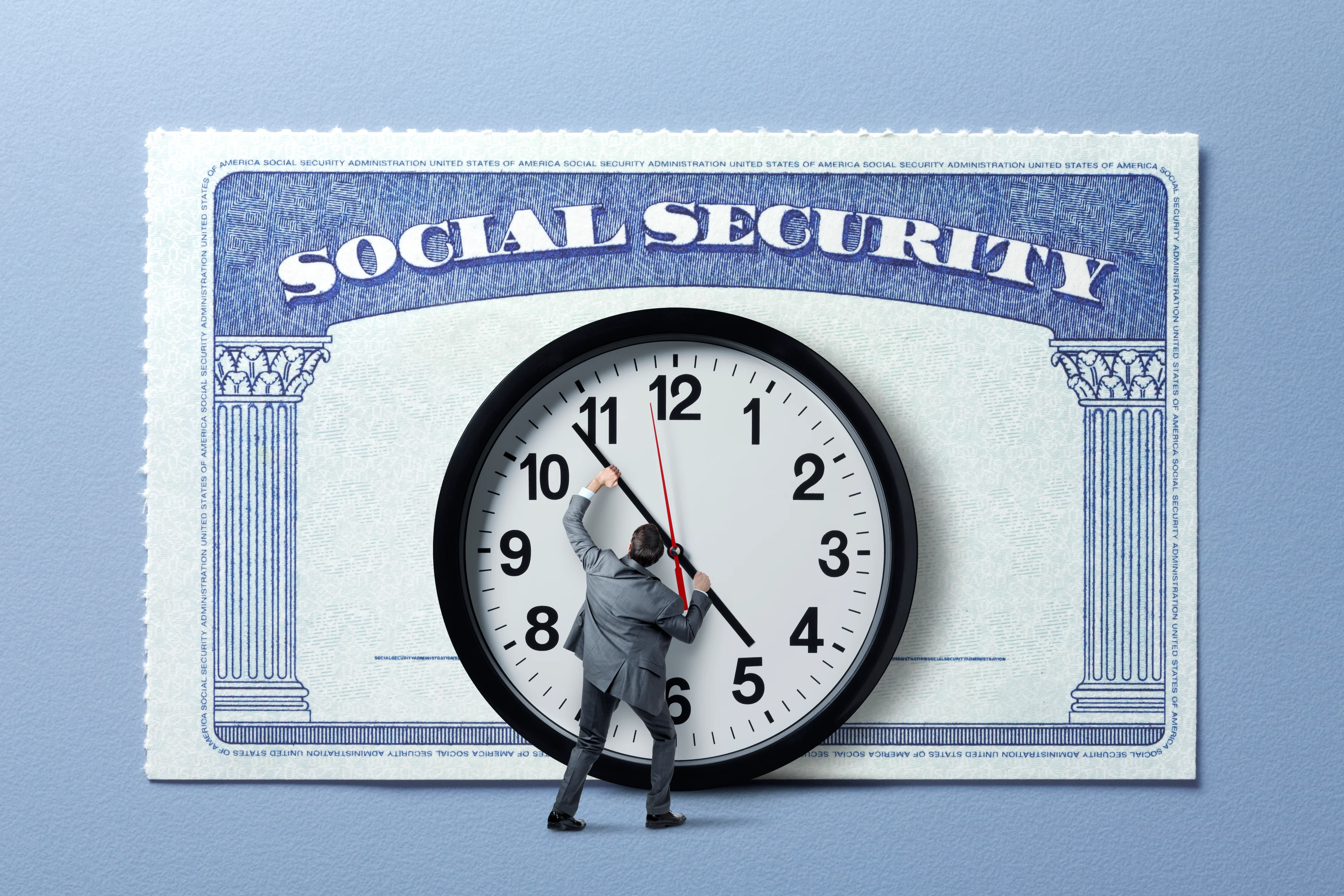 Social Security card behind a person moving hands on a clock.