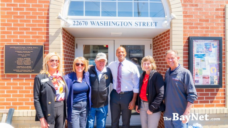 Image: Left: Jennifer Misner, Leonardtown Main Street manager, Heather Earhart, Leonardtown council member, St. Mary's County Commissioner President Randy Guy, Gov. Wes Moore, Laschelle McKay, Leonardtown town administrator, Leonardtown Mayor Dan Burris