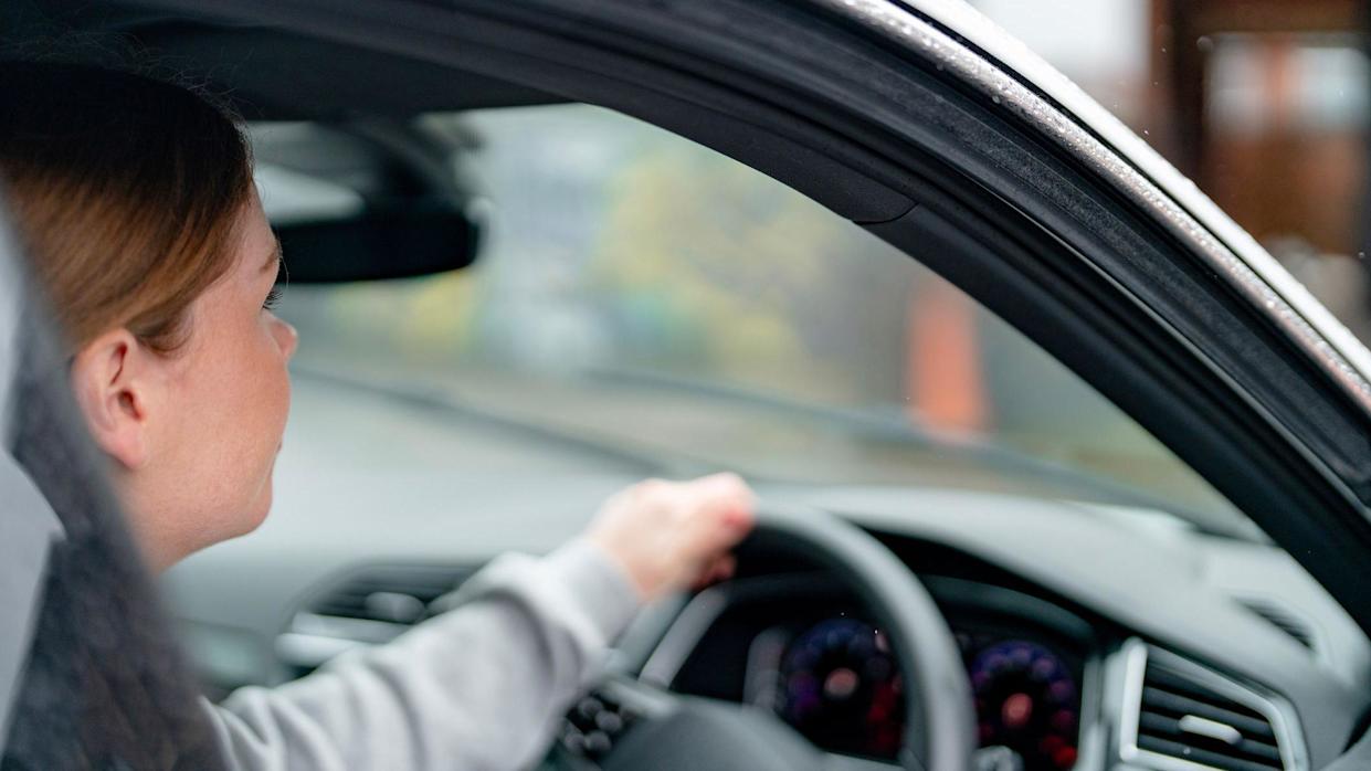 Driver behind the wheel of a car