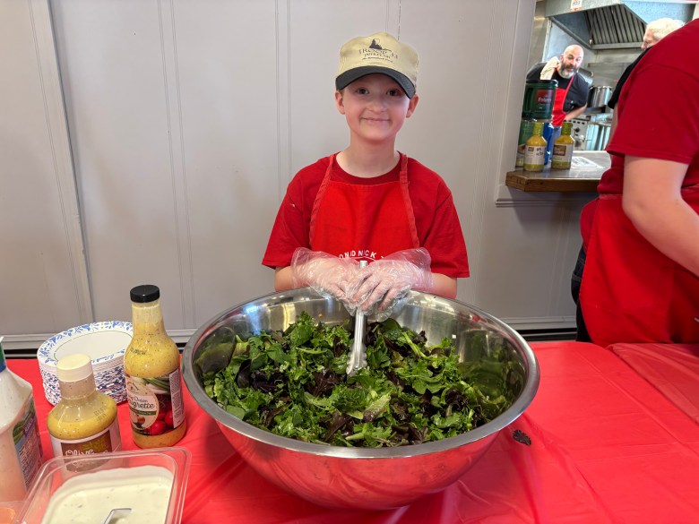 Wally Woodhouse serving salad. 