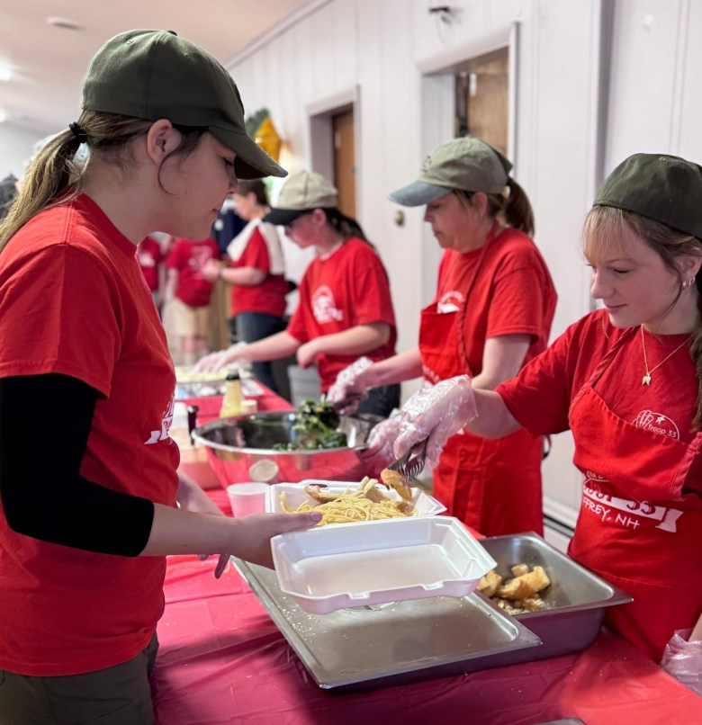 Jesse Levesque, Asstistant Scoutmaster Belinda Backstrom and Maddie Pelletier serving Bella Erickson.