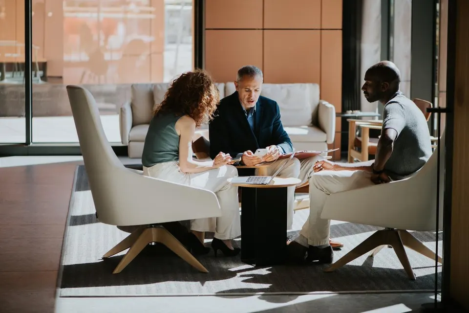 Team Reviewing Information During a Collaborative Business Meeting