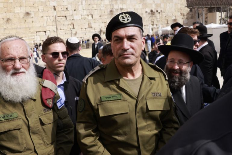 Israel’s armed forces chief, Lieutenant-General Eyal Zamir (centre), has said the army is engaged in a separate “battle” over its budget, one that it is fighting with “empty coffers”