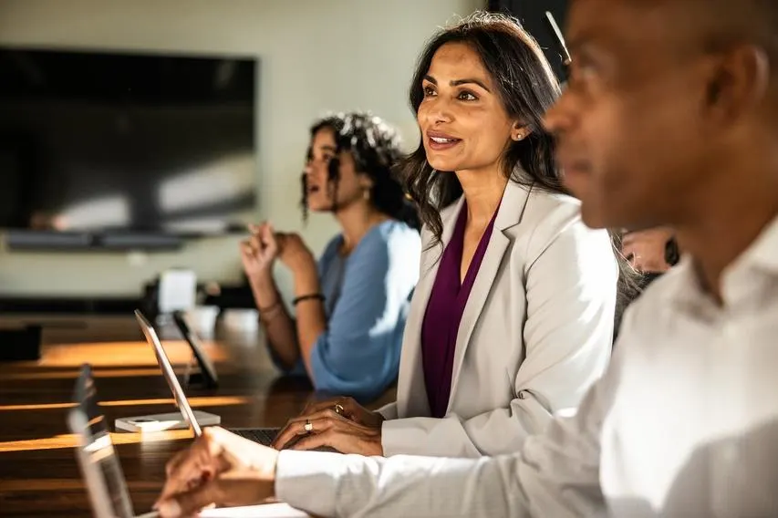 Business colleagues having discussion in modern conference room