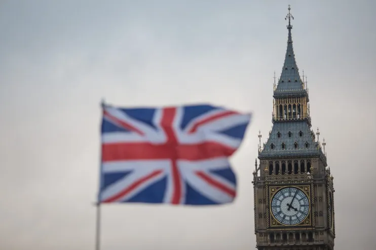 Union Jack flag in front of Elizabeth Tower (Big Ben), Houses of Parliament, London, UK
